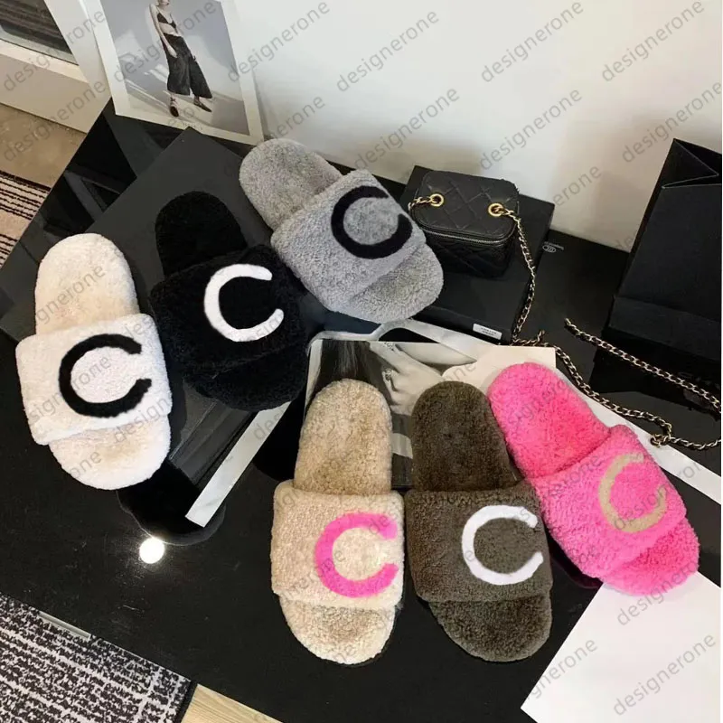 Toboganes de invierno diseñadores para mujeres pelos esponjosas peludas letras calientes pantodas damas sandalias de invierno de